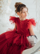 Girls bespoke wedding guest dress with flutter sleeves