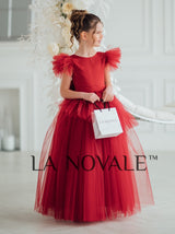 Girls bespoke wedding guest dress with flutter sleeves