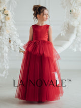 Dark red peplum flower girl dress with ostrich feathers