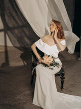 Off shoulder bustier crepe wedding dress