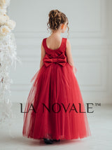 Dark red peplum flower girl dress with ostrich feathers