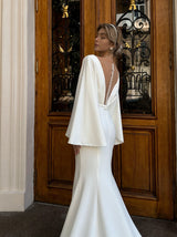 Fit and flare crepe wedding dress with cape sleeves