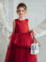 Dark red peplum flower girl dress with ostrich feathers