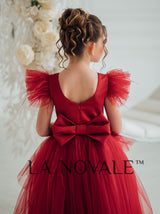 Girls bespoke wedding guest dress with flutter sleeves