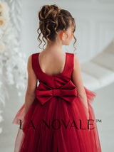 Dark red peplum flower girl dress with ostrich feathers