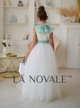 Minimalist flower girl dress with ruffled organza capelet