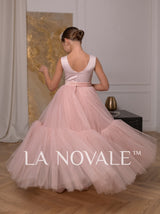 Simple knee length flower girl dress with full overskirt