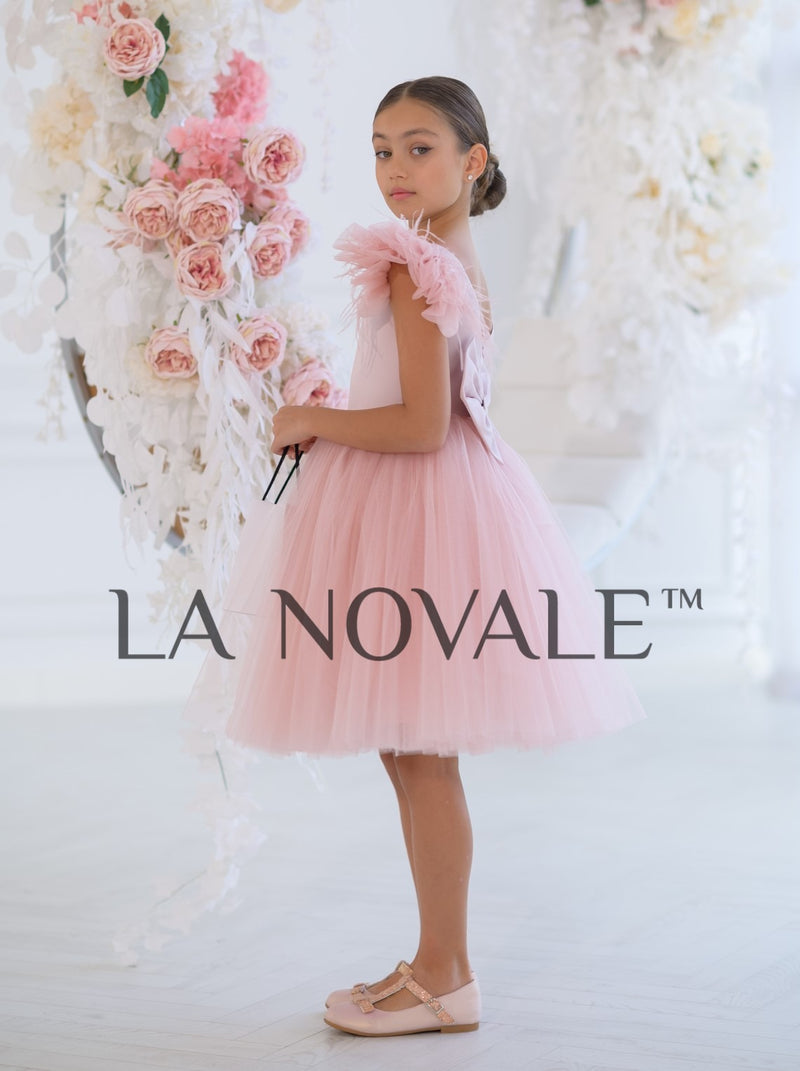 Knee length flower girl dress with ostrich feathers