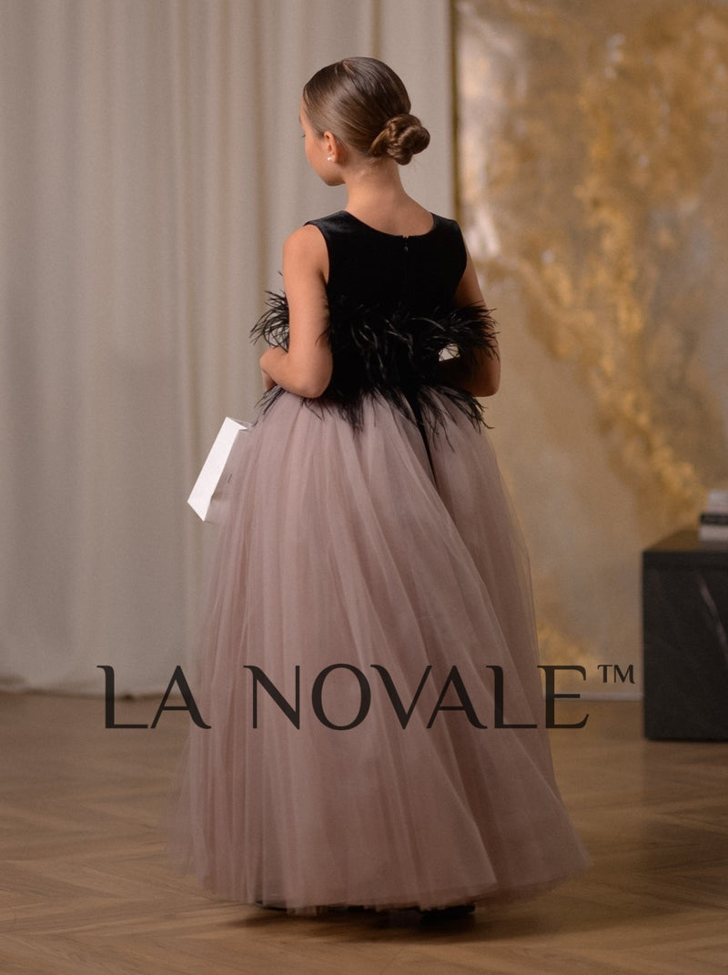 Elegant black velvet junior bridesmaid dress with ostrich feathers