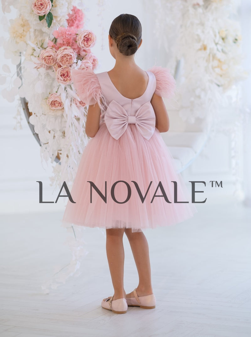 Knee length flower girl dress with ostrich feathers