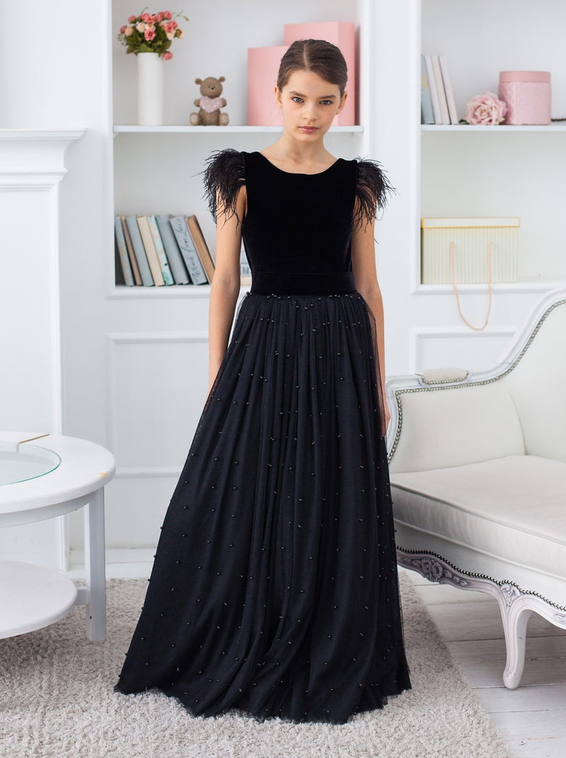 Black velvet girls occasion dress with ostirch feather