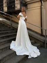 Draped corset glamorous bridal gown with detachable train