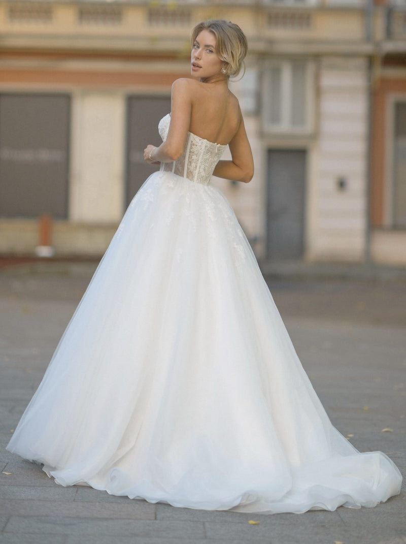 Botanical lace bustier wedding dress with pleated shawl Botanical lace bustier wedding dress with pleated shawl