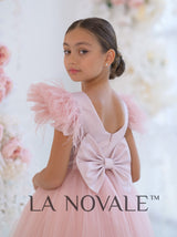 Knee length flower girl dress with ostrich feathers