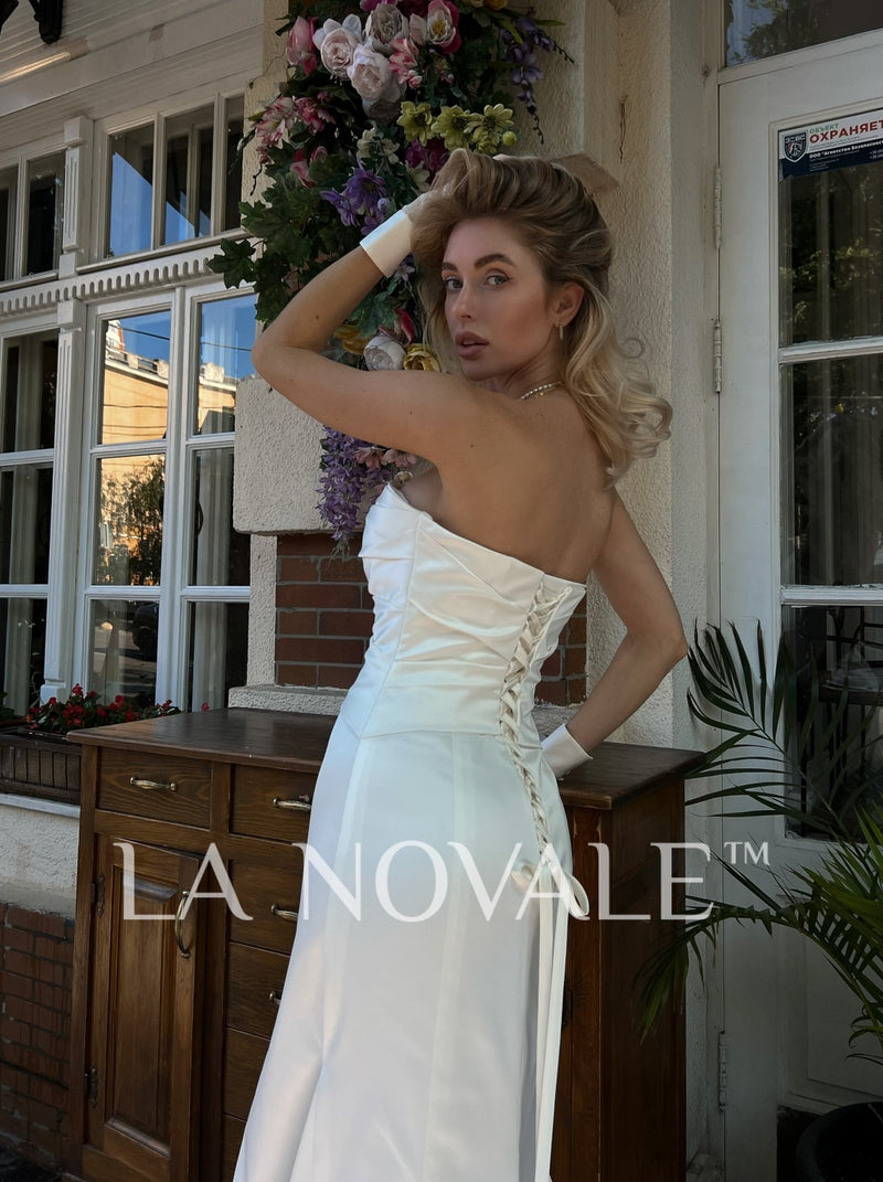 lace up bandeau strapless bridal gown in satin La Novale Atelier lace up bandeau strapless bridal gown in satin La Novale Atelier
