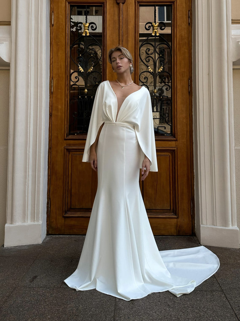 Fit and flare crepe wedding dress with cape sleeves La Novale Atelier Fit and flare crepe wedding dress with cape sleeves La Novale Atelier