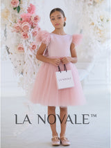 Knee length flower girl dress with ostrich feathers