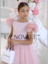 Knee length flower girl dress with ostrich feathers