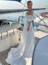 Strapless wedding dress with puff sleeves